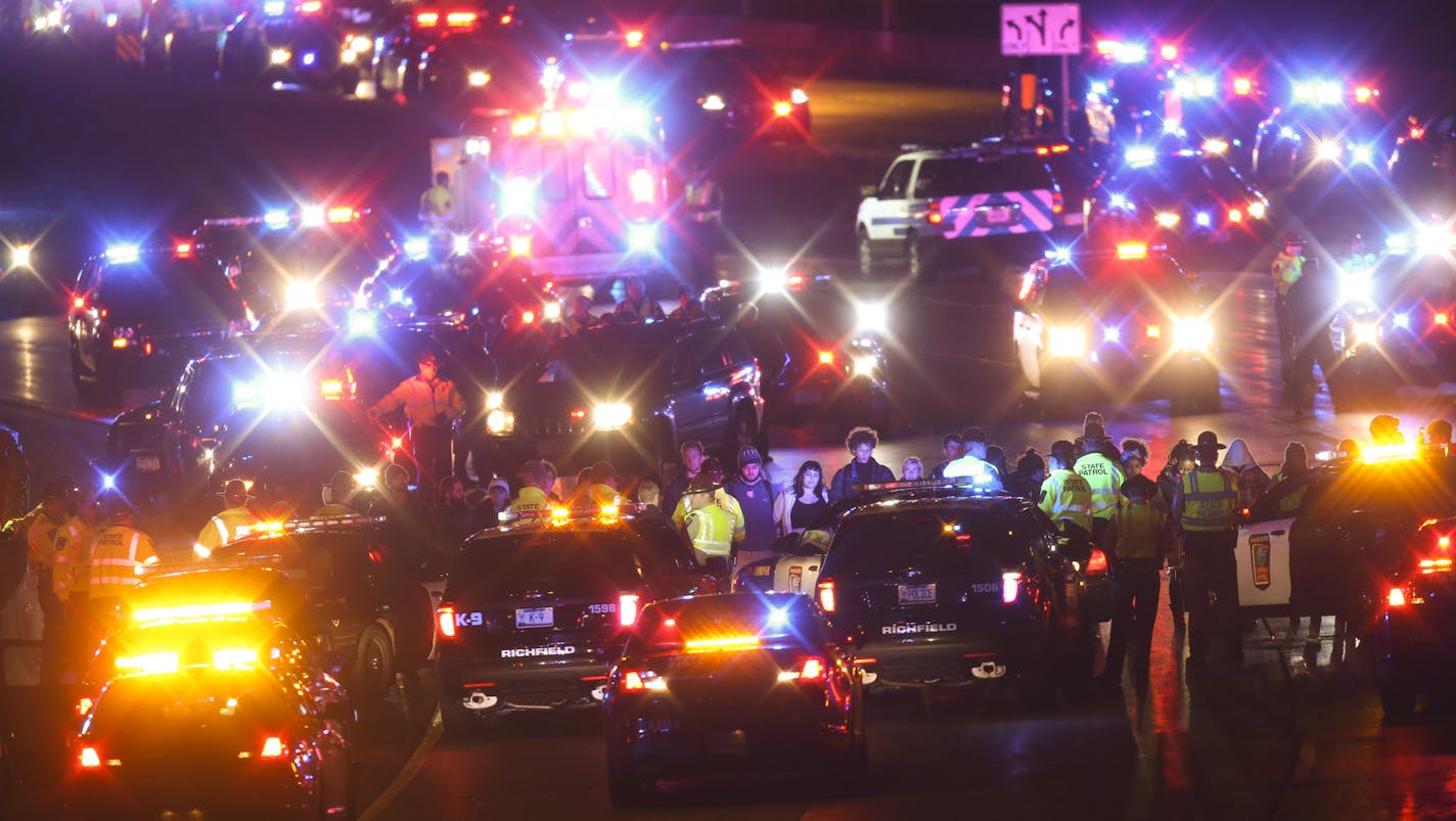 Monday night in Minneapolis. ] JEFF WHEELER &#xef; jeff.wheeler@startribune.com After a man was shot by Minneapolis police early Sunday morning, Black Lives Matters and others protested by marching from the Minneapolis Police 4th Precinct station to I-94, shutting down westbound traffic on the freeway Monday evening.