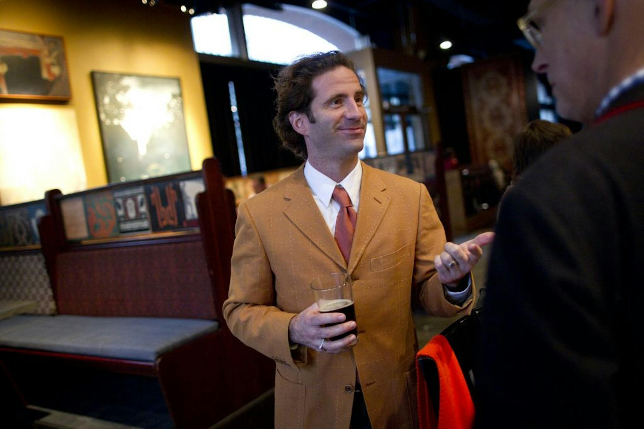 Joe Spencer, St. Paul's director of arts and culture, had a beer with the bar owner Jon Oulman at the Amsterdam Bar and Hall in St. Paul, Minn., Monday, December 19, 2011.