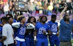The Minneapolis North Polars celebrated with their championship trophy after defeating Rushford-Peterson 30-14 in the Class 1A title game. ] Shari L. 