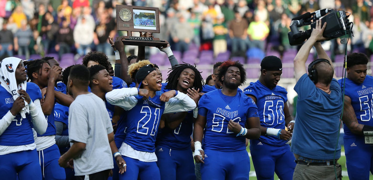 The Minneapolis North Polars celebrated with their championship trophy after defeating Rushford-Peterson 30-14 in the Class 1A title game. ] Shari L. Gross / sgross@startribune.com Minneapolis North defeated Rushford-Peterson 30-14 to earn their first title in the 1A football championship at U.S. Bank Stadium in Minneapolis, Minn. on Saturday, Nov. 26, 2016. ORG XMIT: MIN1611261333371787