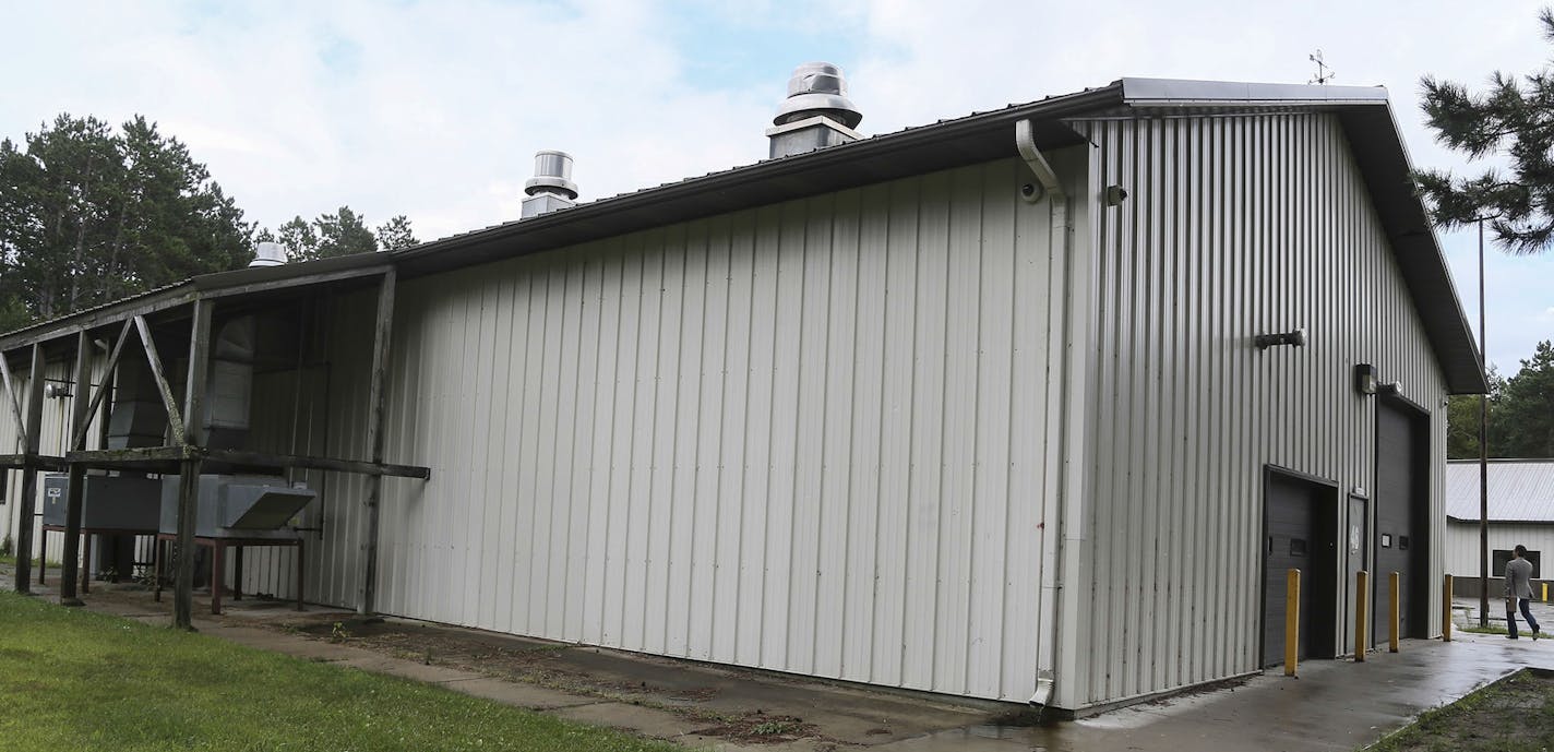 U.S. Interior Secretary Sally Jewell toured the Bug-O-Nay-Ge-Shig High School in Bena, housed in a building that was once a pole shed garage and converted into a school Tuesday, Aug. 19, 2014, in Bena, MN. An exterior of a portion of the high school.] (DAVID JOLES/STARTRIBUNE) djoles@startribune U.S. Interior Secretary Sally Jewell toured the Bug-O-Nay-Ge-Shig High School in Bena, housed in a building that was once a pole shed garage and converted into a school. The high school has received poor