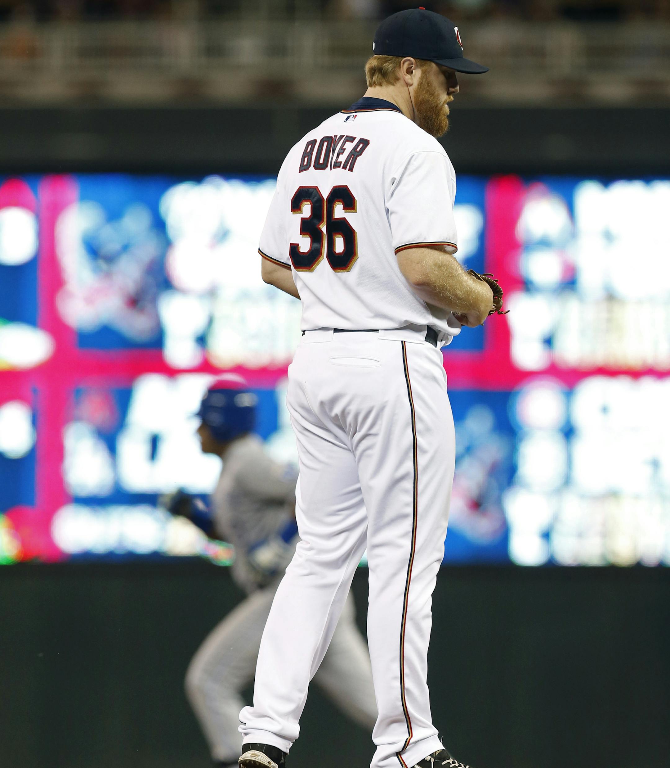 Kansas City Royals’ Salvador Perez rounds the bases on a solo home run off Minnesota Twins pitcher Blaine Boyer, right, in the ninth inning of a baseball game, Tuesday, June 9, 2015, in Minneapolis. The Royals won 2-0. (AP Photo/Jim Mone)