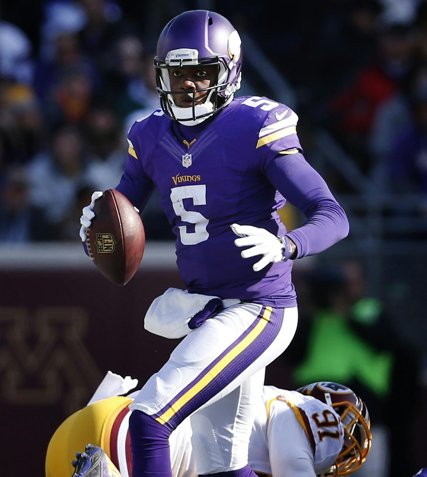 Vikings quarterback Teddy Bridgewater (5) scrambled out of the pocket in the second quarter. ] CARLOS GONZALEZ cgonzalez@startribune.com - November 2, 2014, Minneapolis, Minn., TCF Bank Stadium, NFL, Minnesota Vikings vs. Washington Redskins