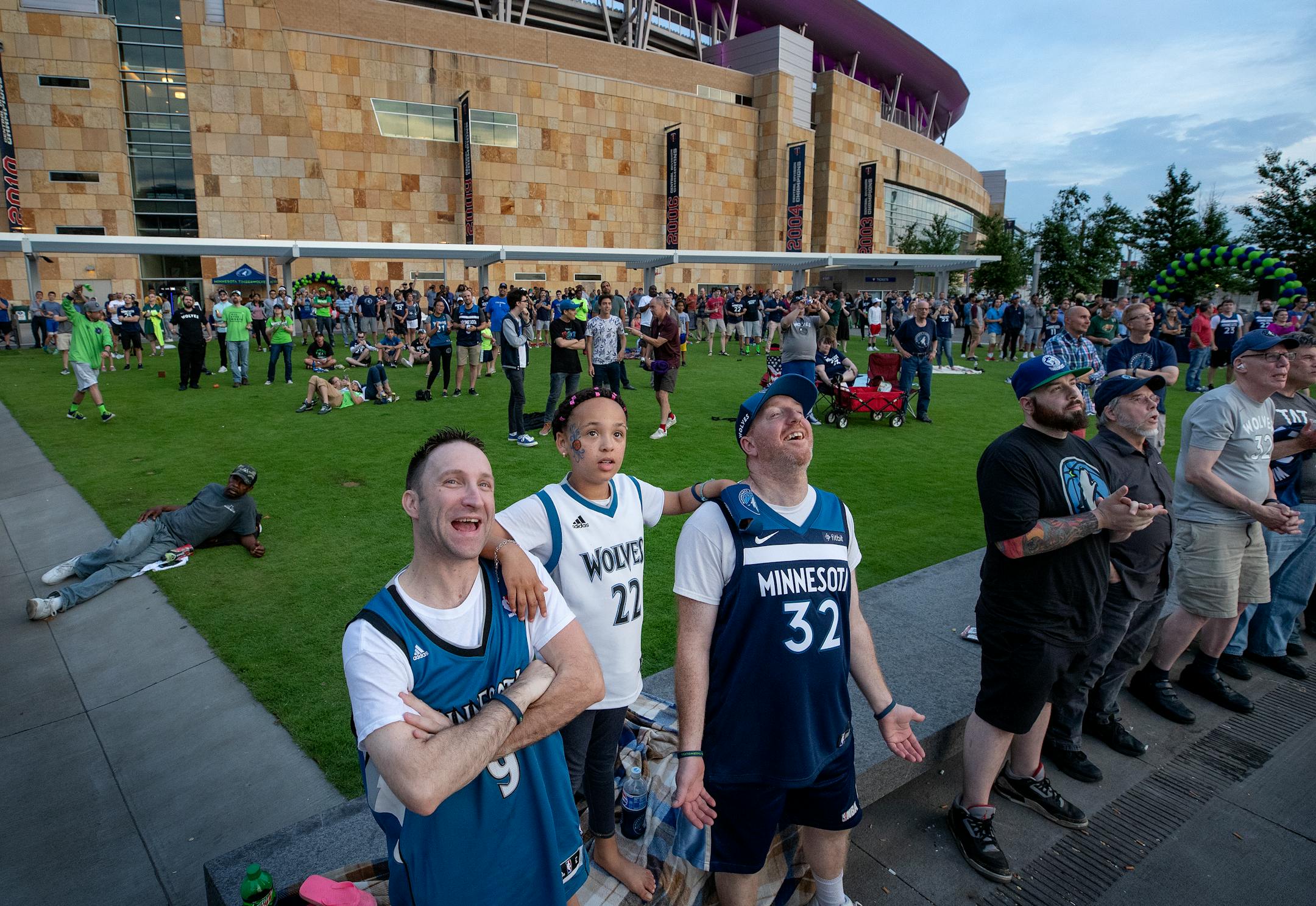 Timberwolves fans James Kouba of Excelsior, Adrianna Reierson, 8, and father Larry of Brooklyn Park reacted after the team picked Georgia Tech shooting guard Josh Okogie
