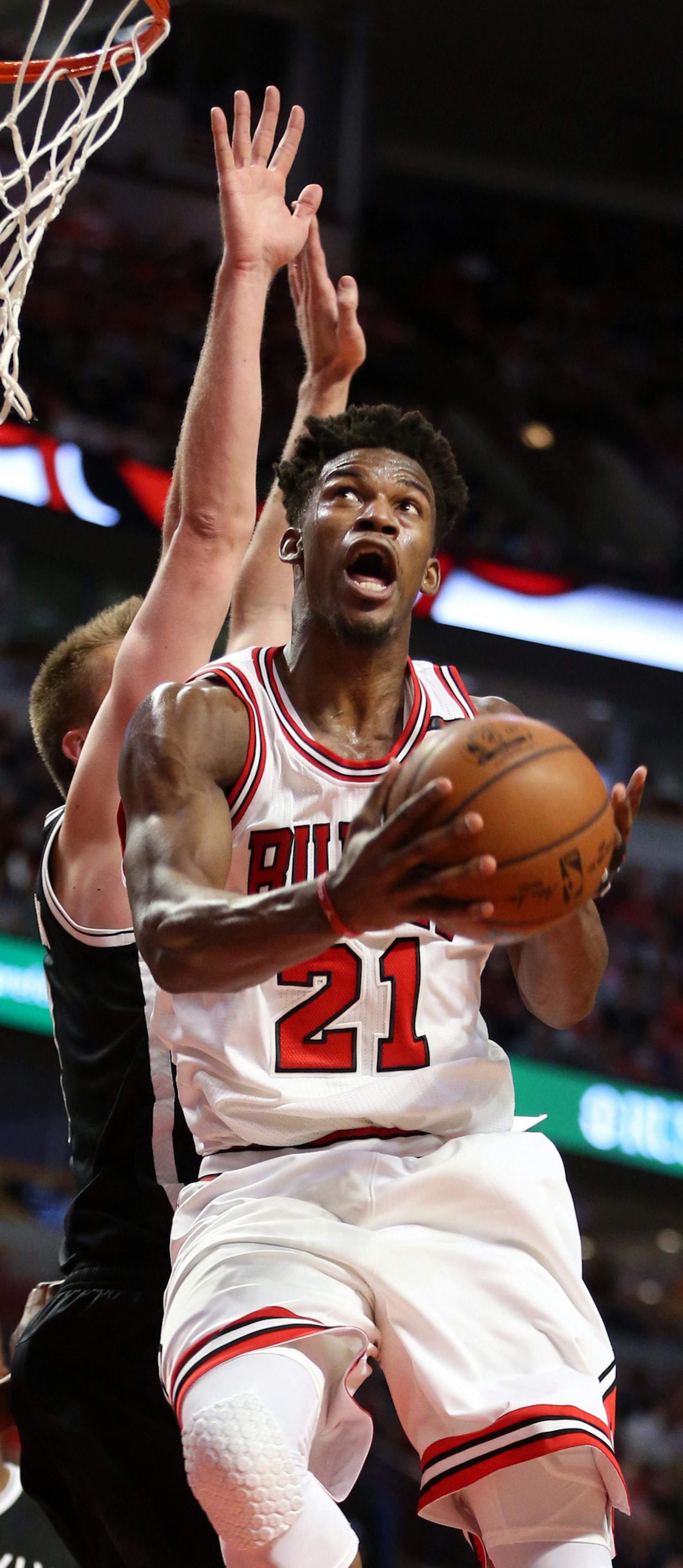 The Chicago Bulls' Jimmy Butler (21) soars to the basket in front of the Brooklyn Nets' Justin Hamilton in the second half at the United Center in Chicago on Wednesday, April 12, 2017. The Bulls won, 112-73. (Terrence Antonio James/Chicago Tribune/TNS) ORG XMIT: 1200581