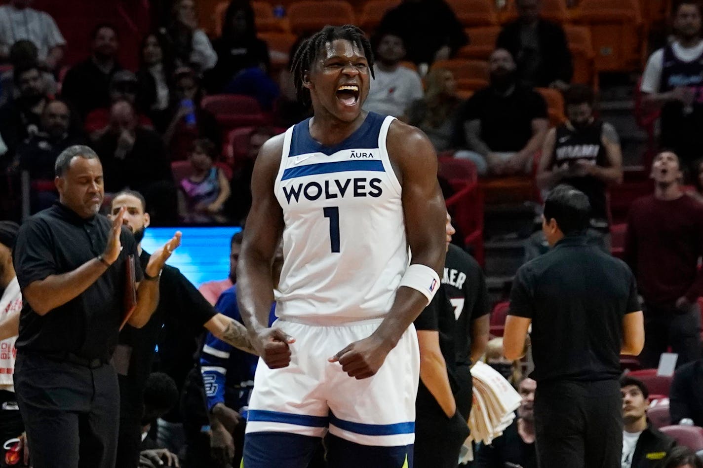 Minnesota Timberwolves forward Anthony Edwards (1) reacts during the last minute of the second half of an NBA basketball game against the Miami Heat, Saturday, March 12, 2022, in Miami. (AP Photo/Marta Lavandier)