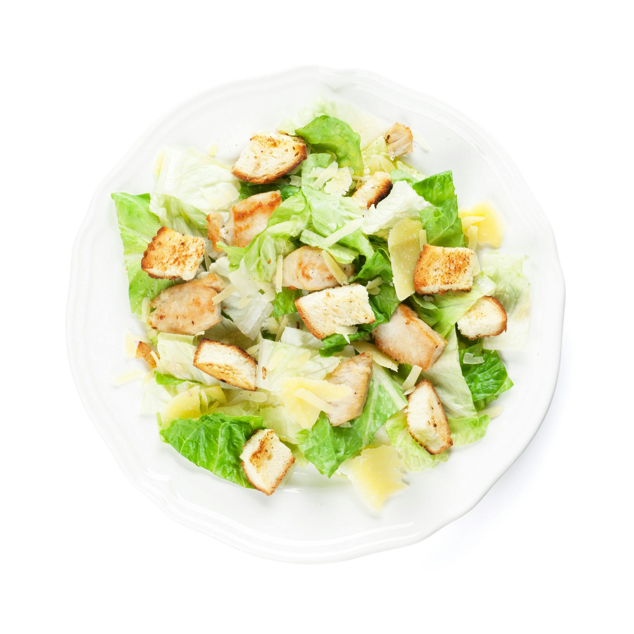 Fresh healthy caesar salad. Isolated on white background. Top view
