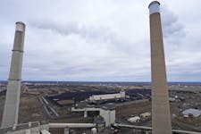 Stacks from Xcel's three large steam turbine-generators, including Sherco 3. Higher costs from a 2011 accident at Sherco 3 could result in customer re
