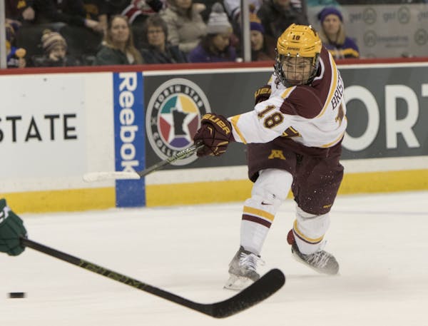 Minnesota Gophers forward Leon Bristedt (18) fires a wrist shot in the first period against Bemidji State.