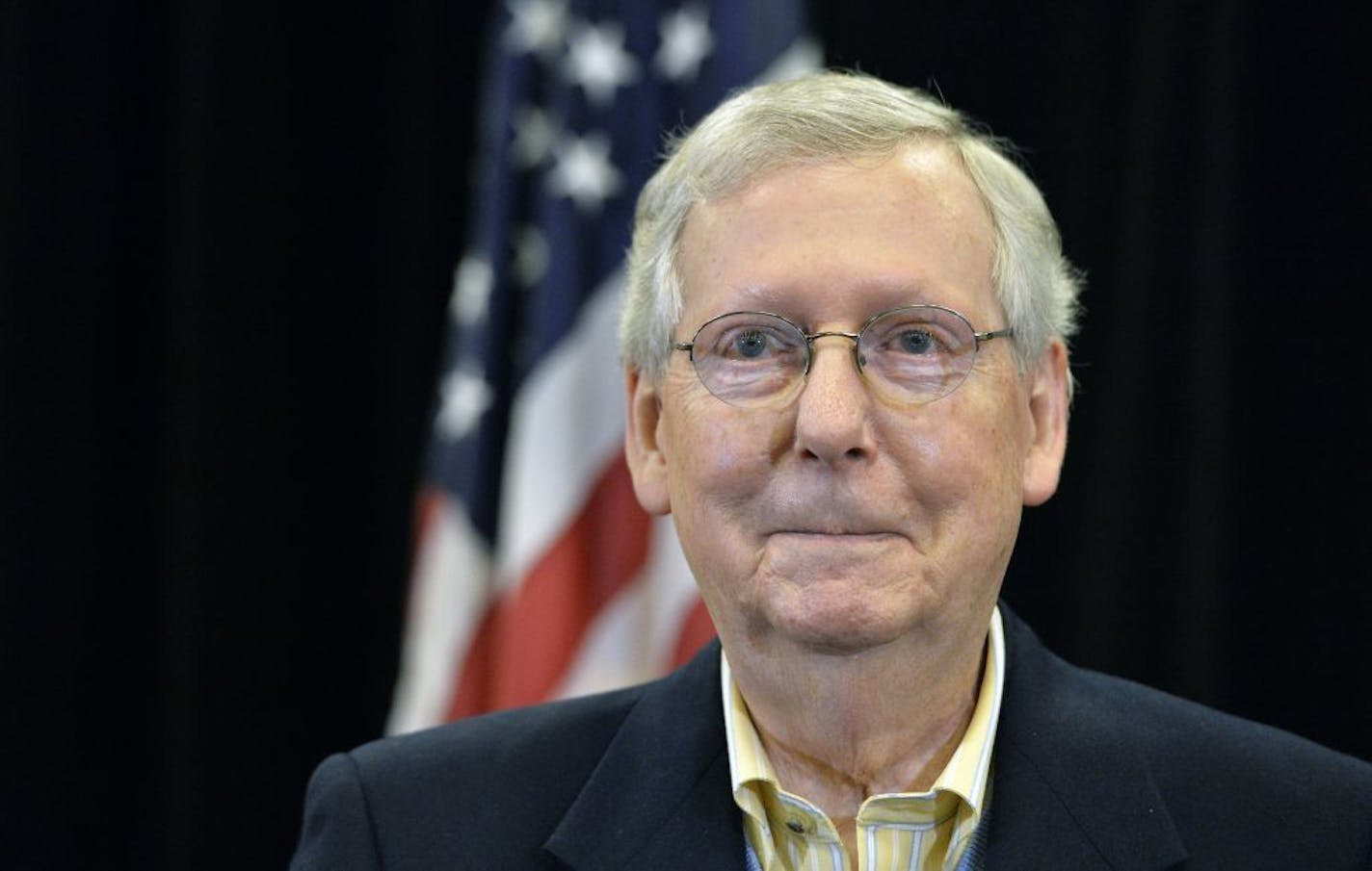 Senate Majority Leader Mitch McConnell, R-Ky., reacted to a question during a news conference Saturday in Louisville, Ky. Hours earlier, the Senate passed the tax bill on a 51-49 vote.