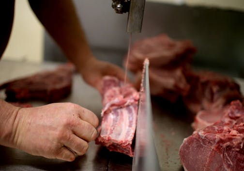 Store owner Dave Jurek cuts up pork chops at Anoka Meat and Sausage Tuesday, Feb. 3, 2015, in Minneapolis, MN.](DAVID JOLES/STARTRIBUNE)djoles@startribune.com Despite the increase demand for locally grown food, a recent study found dozens of small butcher shops in the state could close in the next 10 years**Dave Jurek,cq