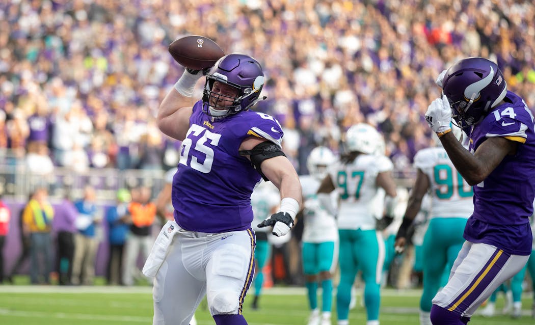 Vikings center Pat Elflein spiked the football after running back Dalvin Cook scored, but the offensive line had penalty issues Sunday.