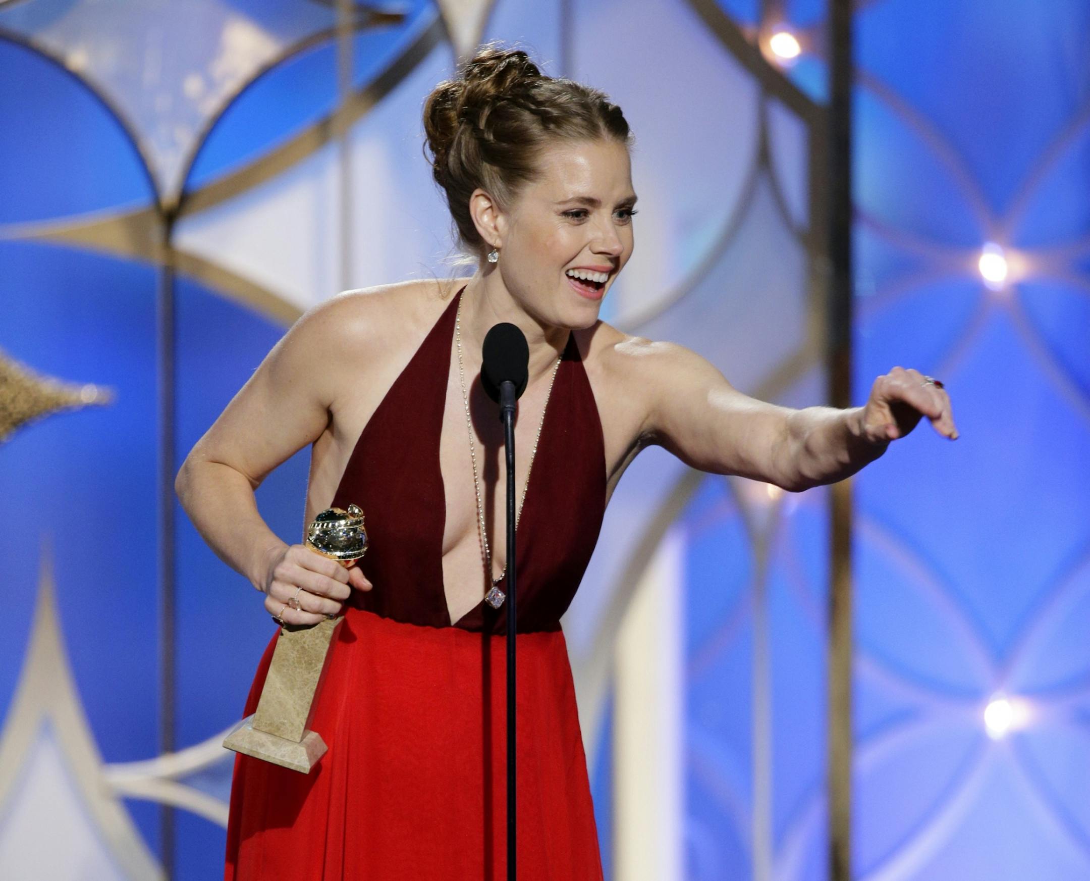 This image released by NBC shows Amy Adams accepting the award for best actress in a motion picture, musical or comedy for her role in, "American Hustle" during the 71st annual Golden Globe Awards at the Beverly Hilton Hotel on Sunday, Jan. 12, 2014, in Beverly Hills, Calif.