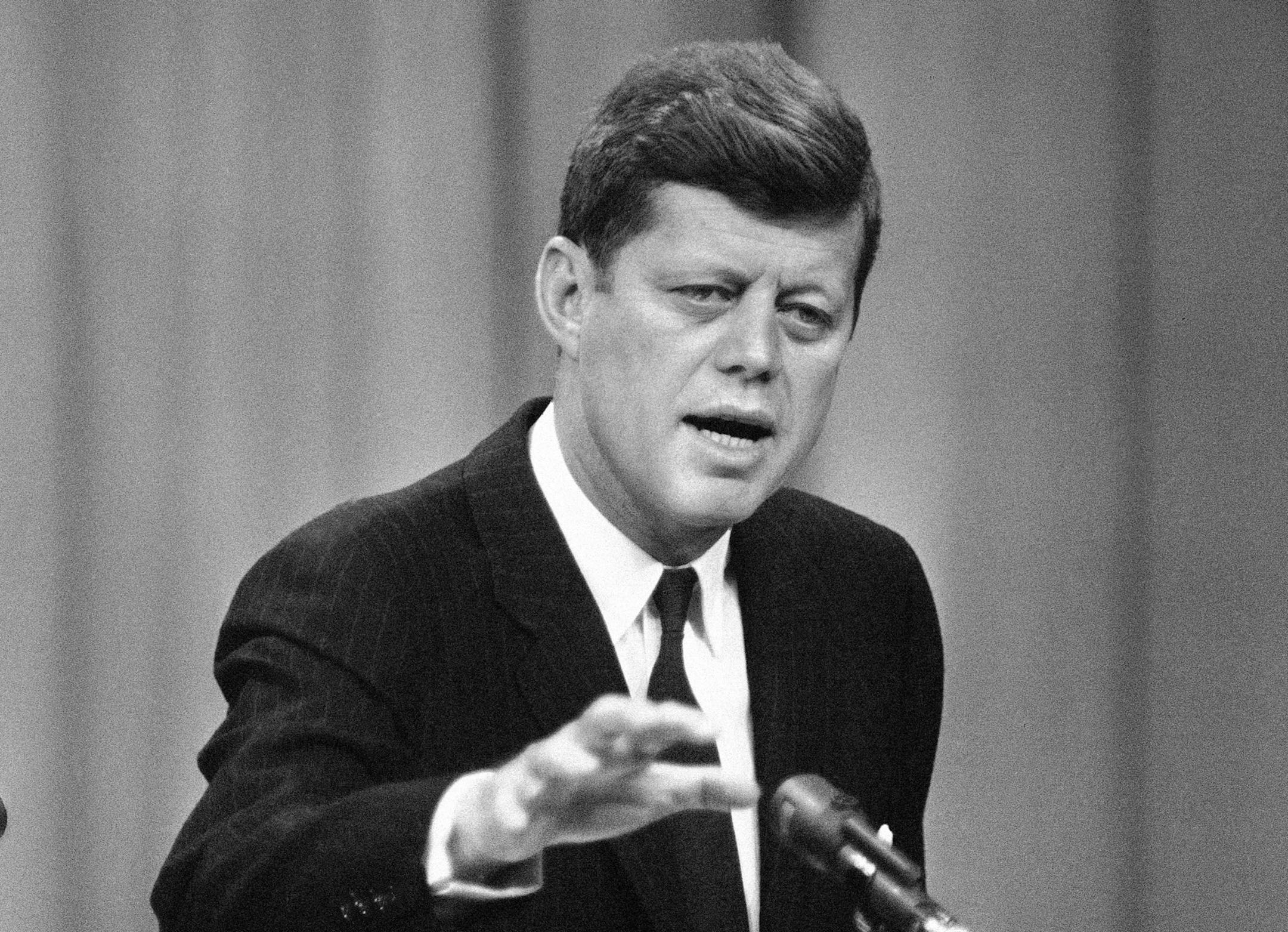 FILE - In this April 12, 1961, file photo, President John F. Kennedy answers a question during his ninth presidential news conference in Washington The conference dealt largely with space exploration and international affairs. A president’s first 100 days can be a tire-squealing roar from the starting line, a triumph of style over substance, a taste of what’s to come or an ambitious plan of action that gets rudely interrupted by world events. (AP Photo/RMB)