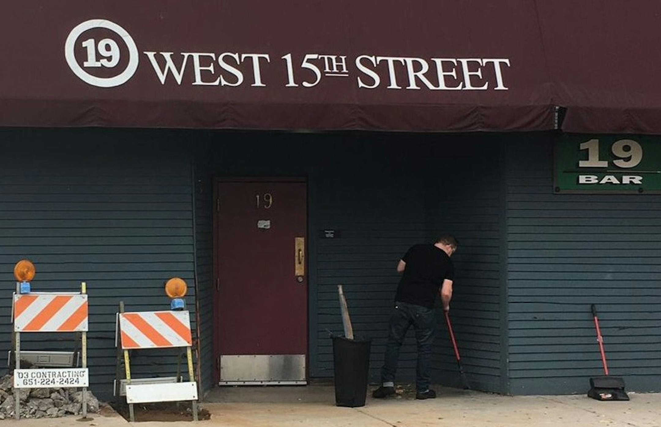 A worker cleaned up the aftermath of an overnight crash outside of 19 Bar in Loring Park on Saturday morning.