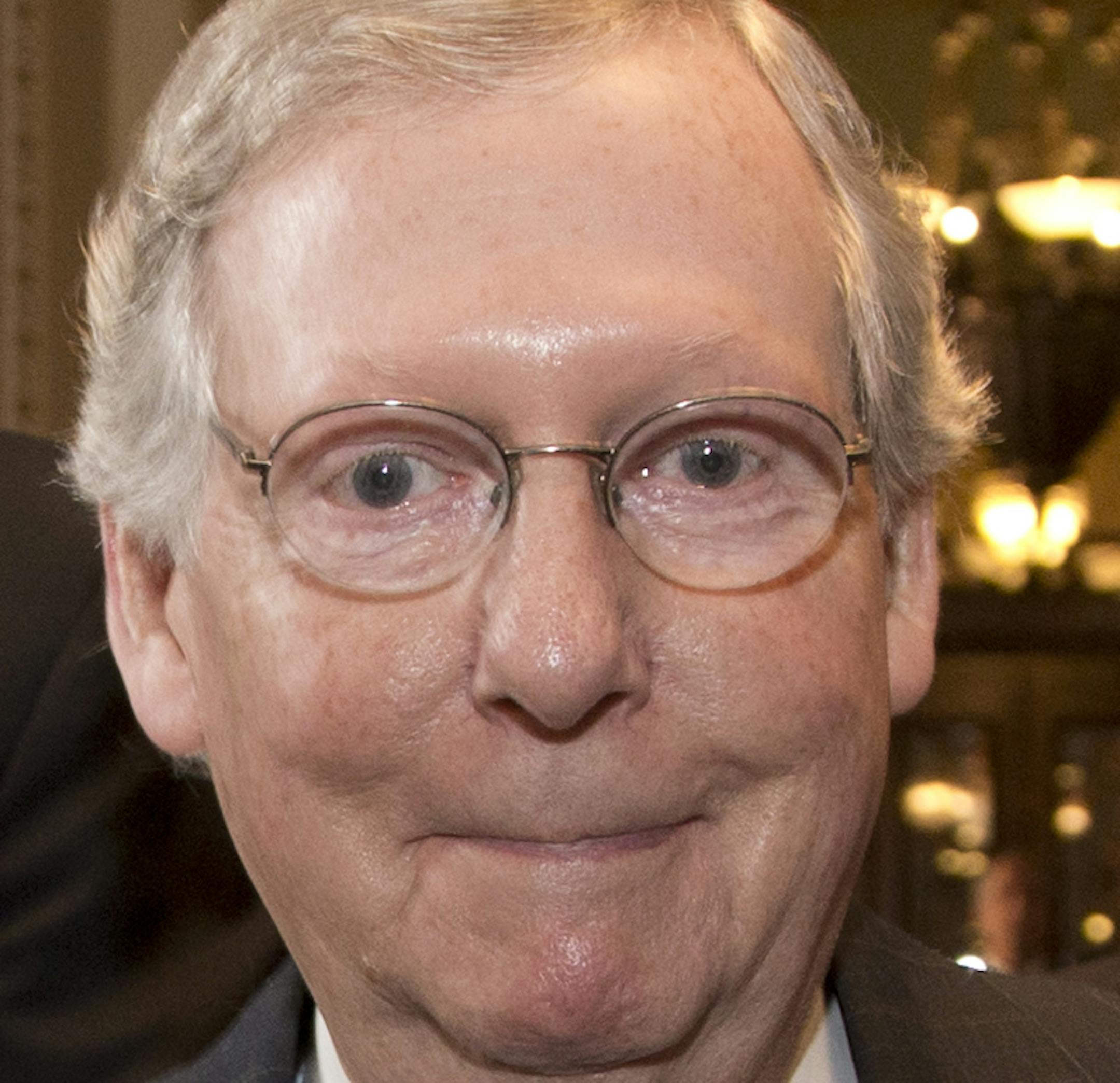 Senate Minority Leader Sen. Mitch McConnell, R-Ky., is followed by reporters after agreeing to the framework of a deal to avoid default and reopen the government on Capitol Hill on Wednesday, Oct. 16, 2013 in Washington. The partial government shutdown is in its third week and less than two days before the Treasury Department says it will be unable to borrow and will rely on a cash cushion to pay the country's bills. (AP Photo/Carolyn Kaster)