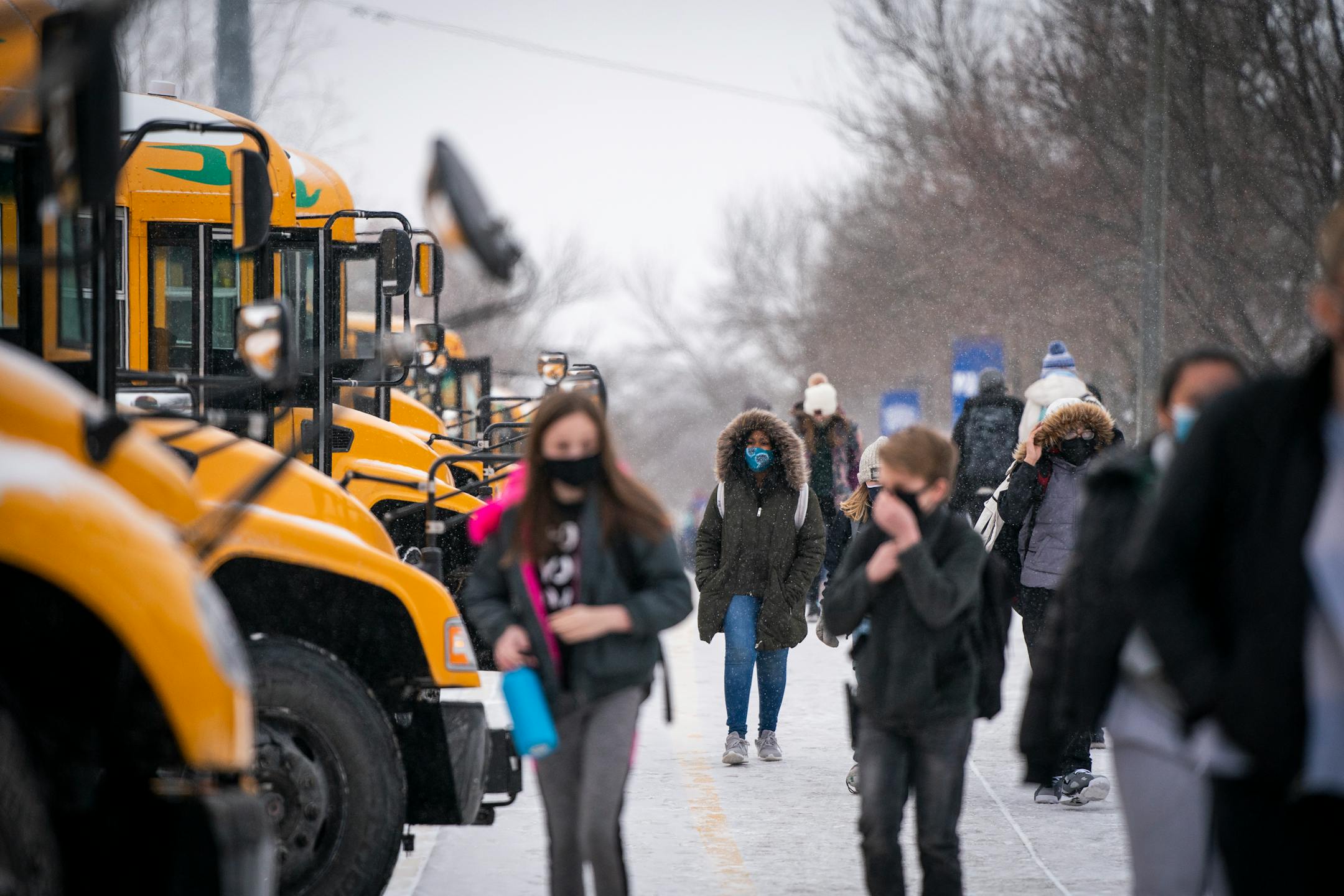 Student get on buses at the end of the day at Jackson Middle School in Champlin.