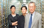 Banker Thomas Sung is shown with his daughters, Vera and Jill, in the documentary "Abacus: Small Enough to Jail." (Sean Lyness / PBS Films) ORG XMIT: 