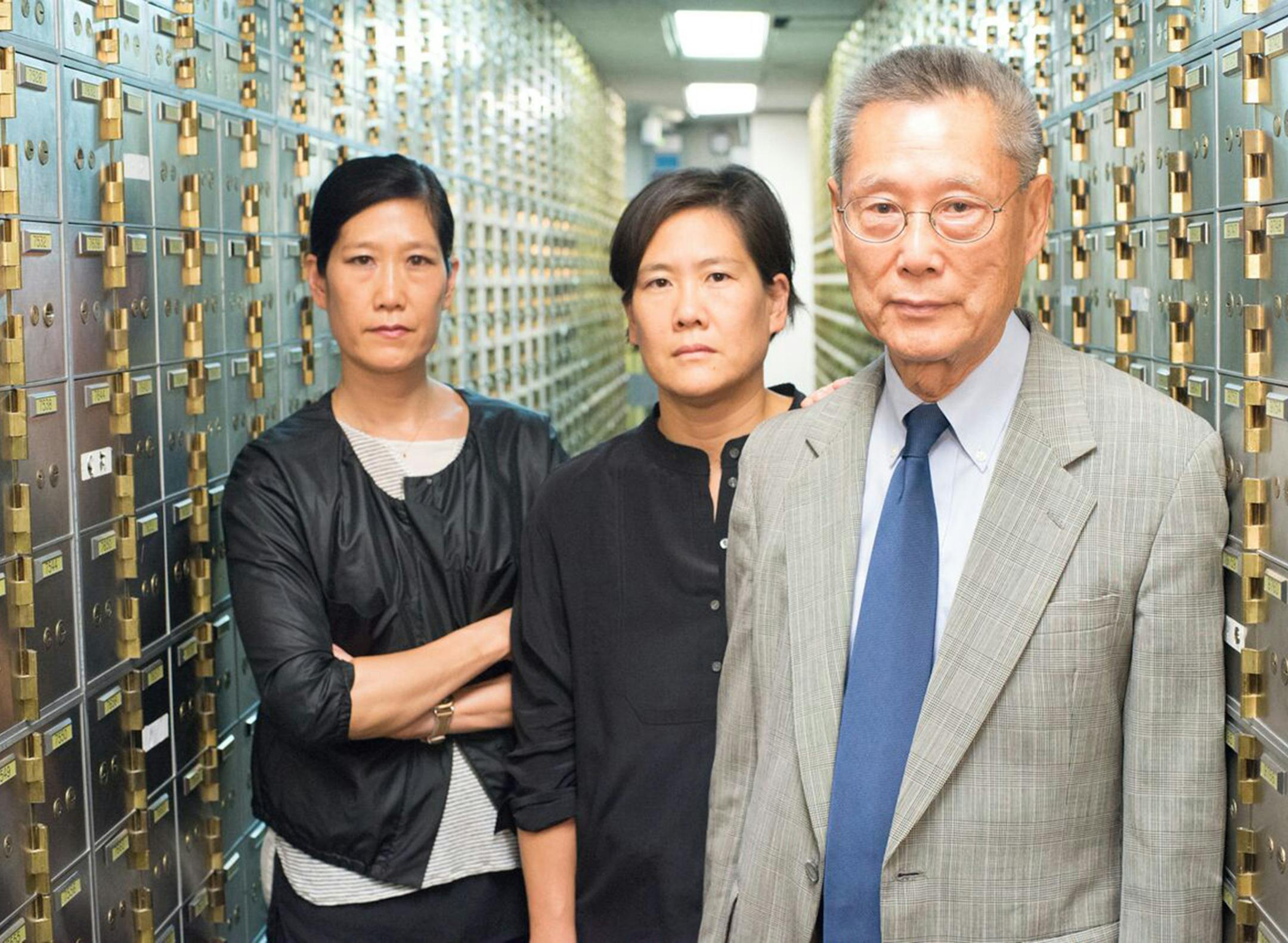 Banker Thomas Sung is shown with his daughters, Vera and Jill, in the documentary "Abacus: Small Enough to Jail." (Sean Lyness / PBS Films) ORG XMIT: 1203840