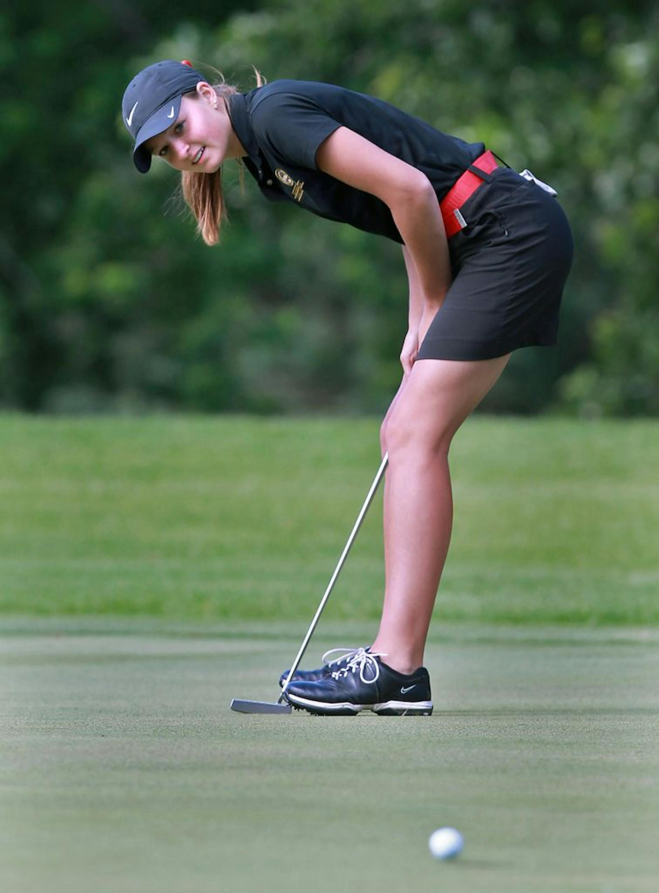 New Prague's McKenzie Neisen watched her birdie putt roll in on No. 7 on the seventh hole at Bunker Hills in Coon Rapids. She shot a 4-under 69 to take a three-shot lead in the Class 3A girls' tournament.