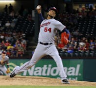 Minnesota Twins starting pitcher Ervin Santana delivers to the Texas Rangers in the sixth inning of a baseball game in Arlington, Texas, Tuesday, Apri
