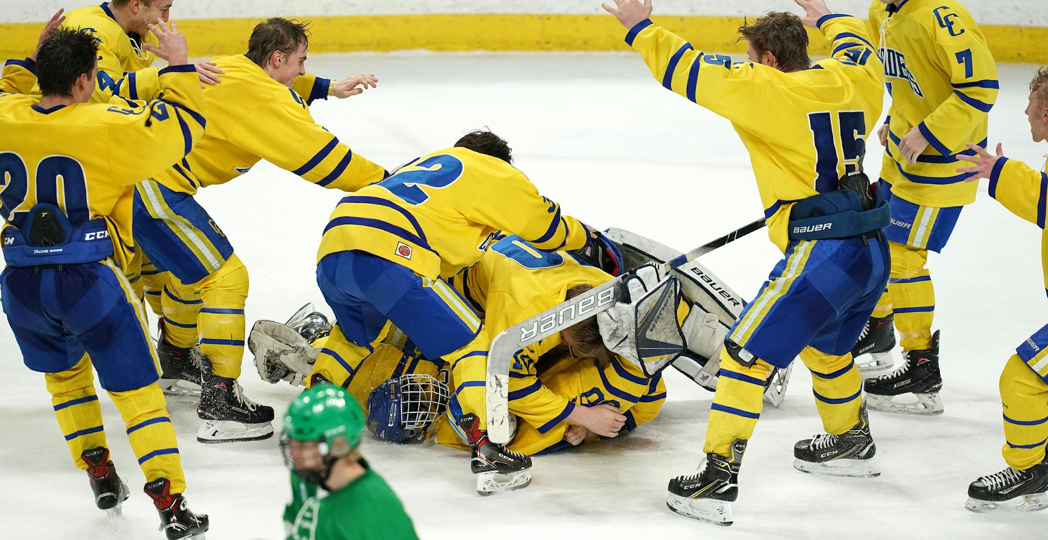 St. Cloud Cathedral goaltender Noah Amundson (30) and defenseman Luke Schmidt (21) were mobbed by their teammates as they celebrated the win over Greenway at the end of the third period. ] ANTHONY SOUFFLE &#x2022; anthony.souffle@startribune.com St. Cloud Cathedral High School played Greenway High School in a MSHSL Class 1A boys hockey championship game Saturday, March 9, 2019 at the Xcel Energy Center in St. Paul, Minn.