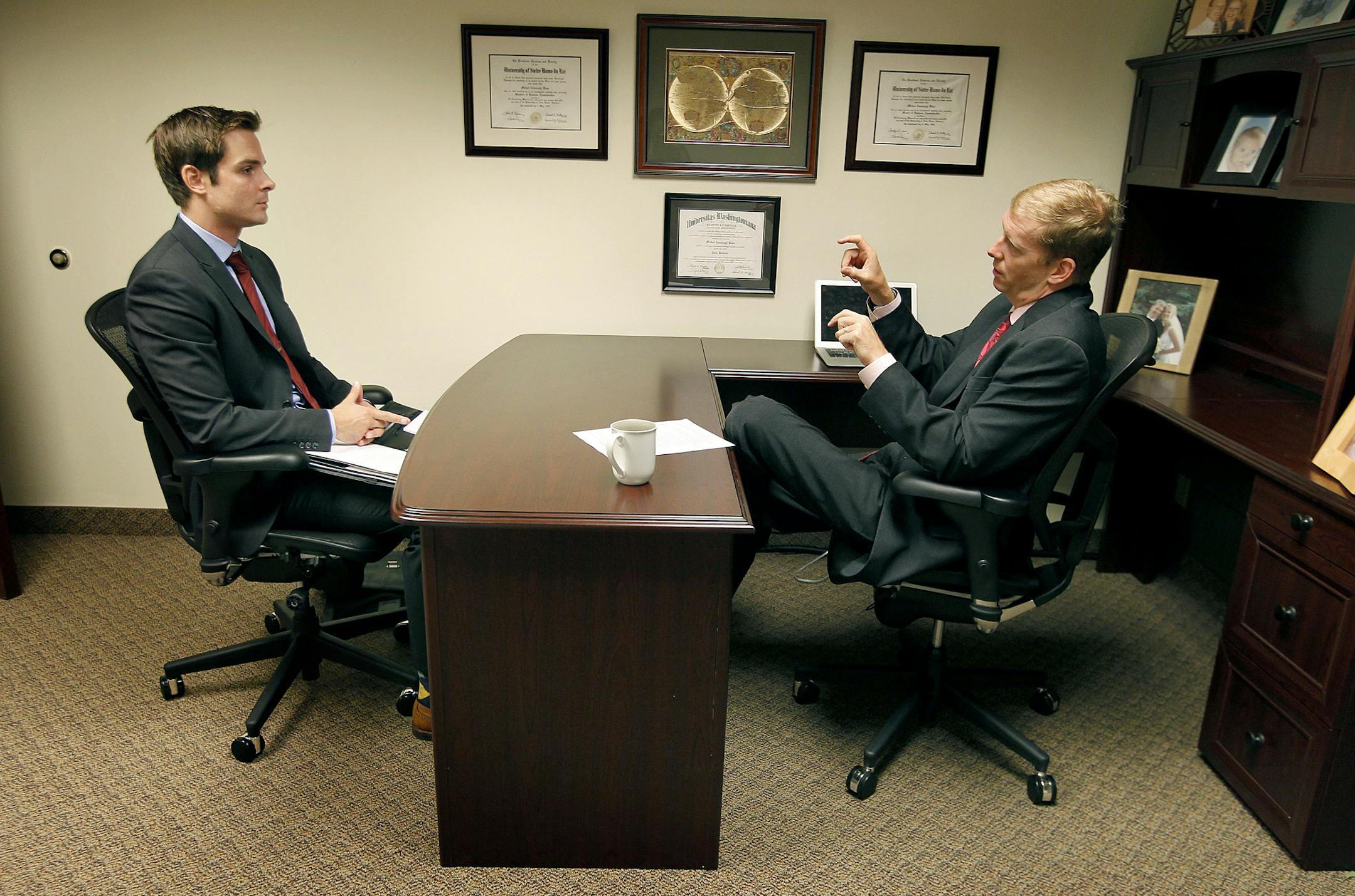 Michael Blaes who recently set up a new office for Counsel on Call at the Calhoun Business Center, interviewed St. Thomas Law graduate Josh Socks, Thursday, September 5, 2013 in Minneapolis, MN. The Minneapolis legal market just got a tad more competitive with the arrival of Counsel on Call, a consortium of independent attorneys who contract with corporate clients to provide specific legal services. The national firm sees ample opportunity in the Twin Cities with its bevy of Fortune 500 companie