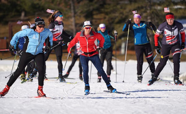 Jessie Diggins (center in Red), the Olympic Gold Medal winning cross country skier from Stillwater, skied with local high school skiers at Theodore Wi