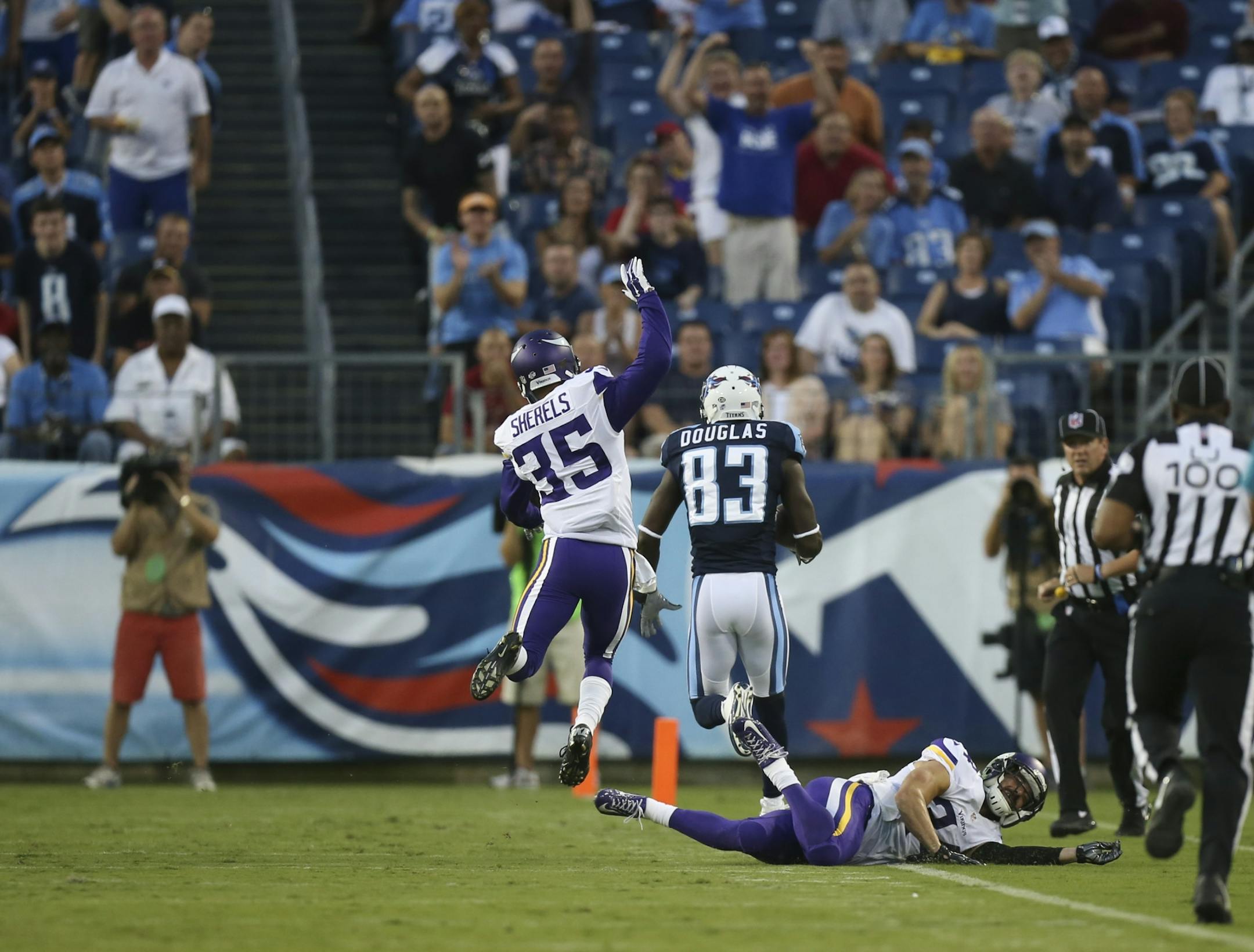 Tennessee Titans wide receiver Harry Douglas (83) left Vikings cornerback Marcus Sherels (35) and strong safety Andrew Sendejo (34) in his wake as he caught a short pass for a 59 yard touchdown in the first quarter Thursday night.