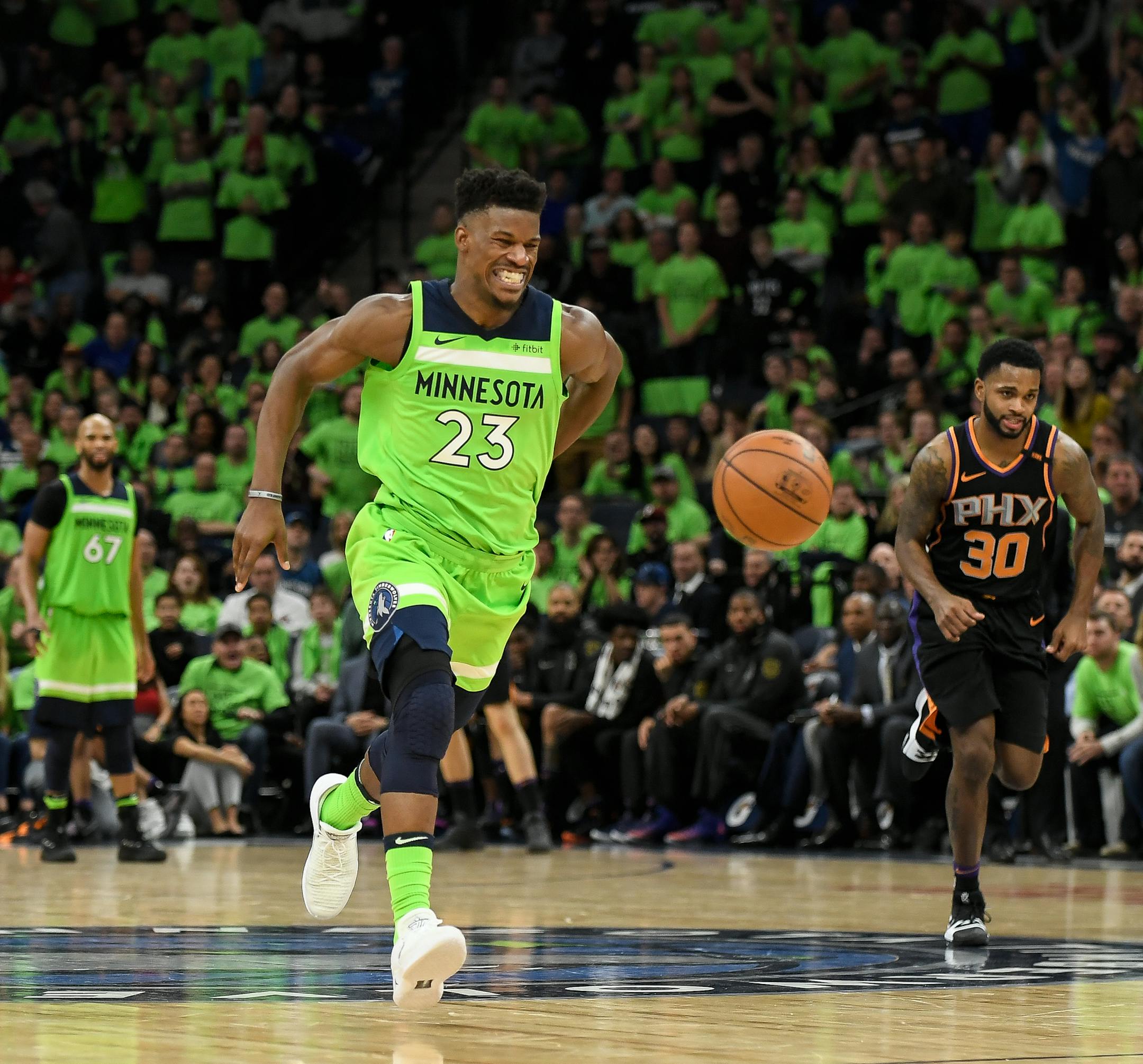 Minnesota Timberwolves guard Jimmy Butler (23) winced in pain while holding his backside as he broke away for a dunk in the fourth quarter against the Phoenix Suns. ] AARON LAVINSKY &#xef; aaron.lavinsky@startribune.com The Minnesota Timberwolves played the Phoenix Suns on Saturday, Dec. 16, 2017 at Target Center in Minneapolis, Minn.