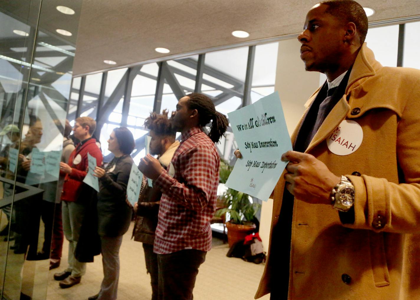 A coalition of advocates for immigrants and minority groups stood outside a county budget meeting last November to protest increases in arrests and deportations.