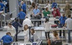 Travelers made their way through one of the two TSA security checkpoints at Terminal 1 at the Minneapolis/St. Paul International Airport in May.