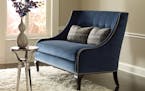credit: Taylor King Furniture The Raina settee by Taylor King is perfectly tailored in rich dark blue velvet with matching buttons.