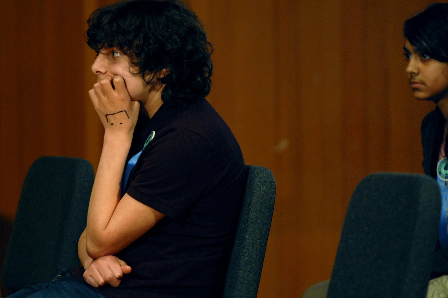 Cody DuBois, a seventh grader at Emerson SILC in Minneapolis and Apekshya Panda, a sixth grader at Wayzata Middle School, await their questions.