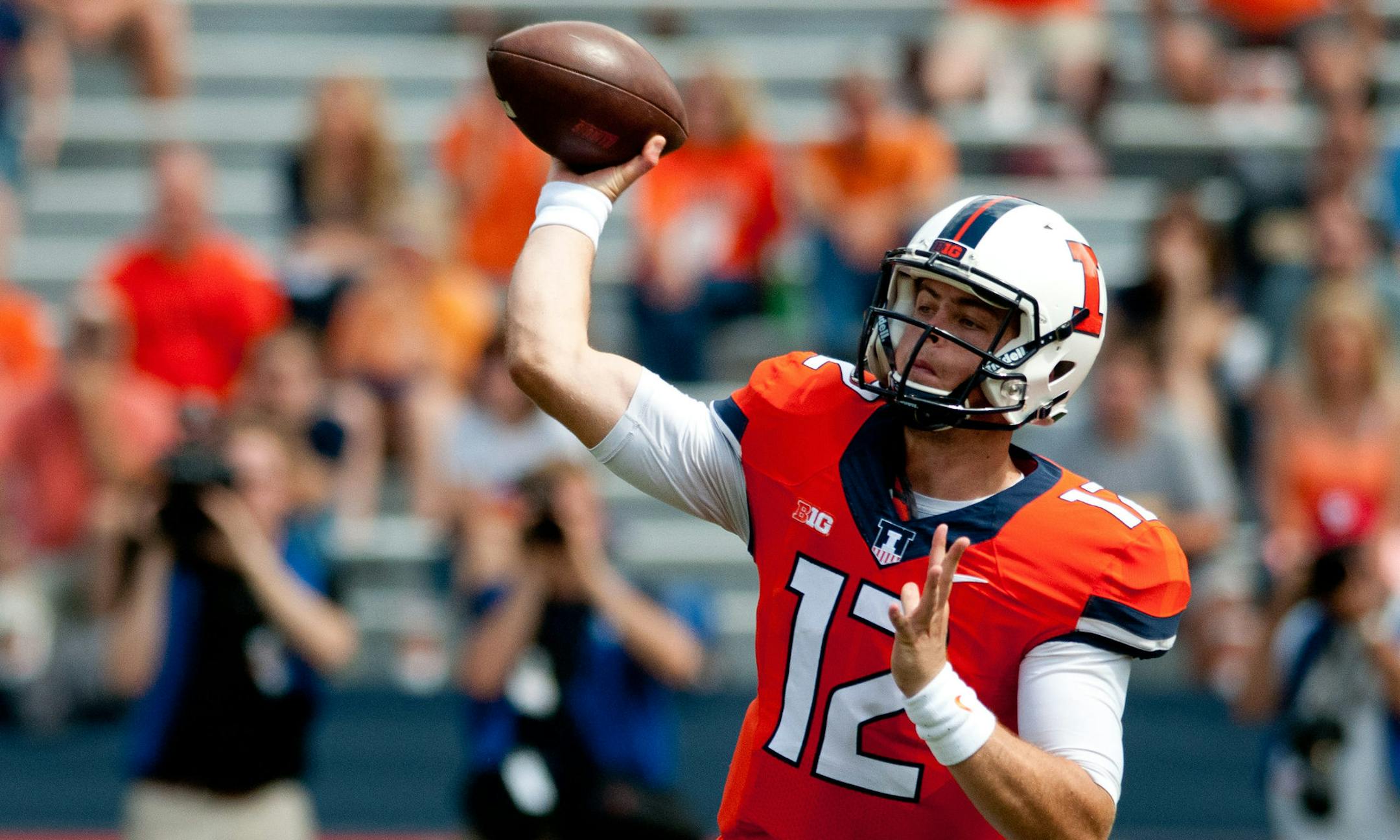 Illinois quarterback Wes Lunt (12) throws the ball during the third quarter of an NCAA college football game against Western Kentucky, Saturday, Sept. 6, 2014, at Memorial Stadium in Champaign, Ill. (AP Photo/Bradley Leeb)