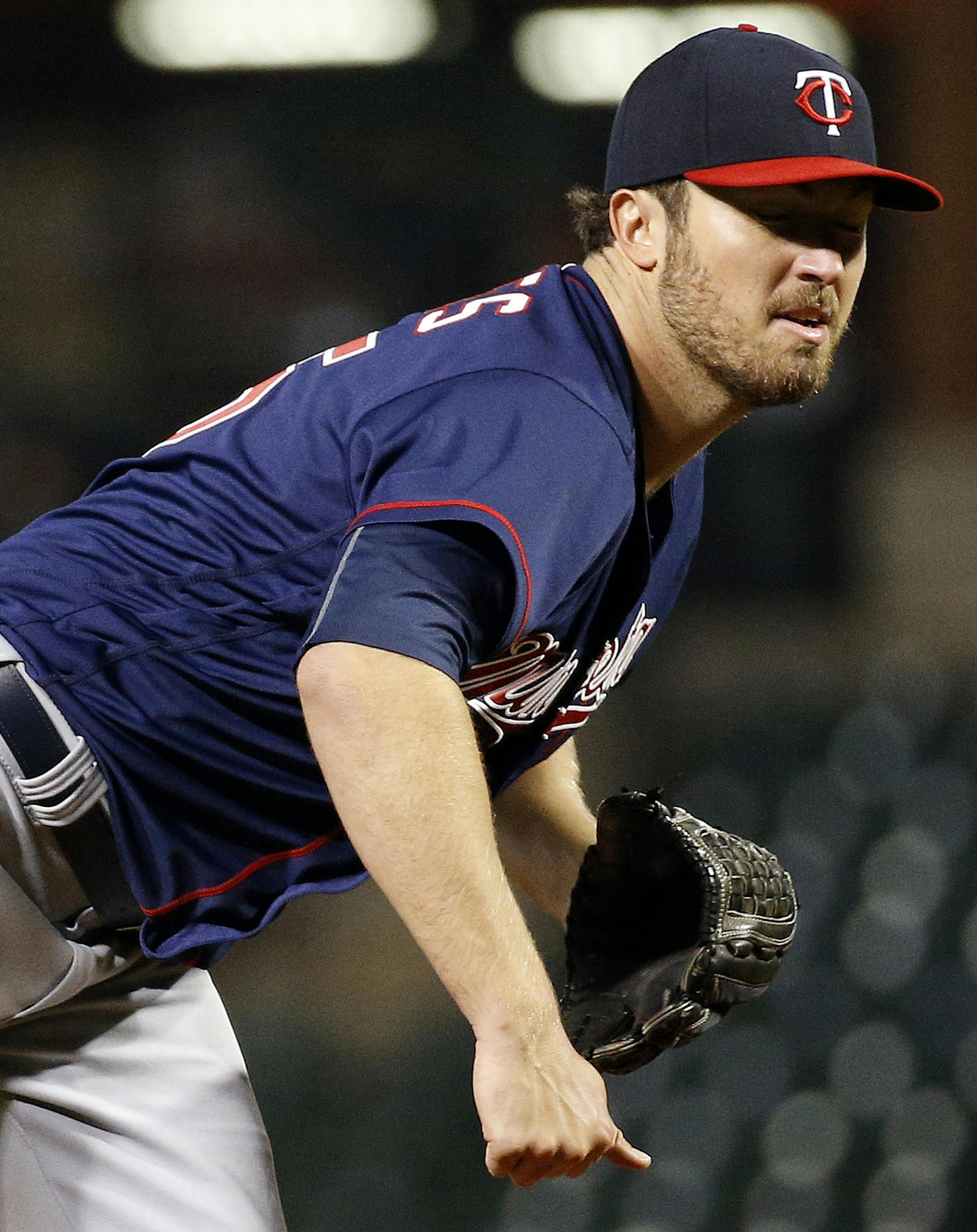 Minnesota Twins starting pitcher Phil Hughes follows through on a pitch to the Baltimore Orioles during the seventh inning of a baseball game in Baltimore, Thursday, April 7, 2016. (AP Photo/Patrick Semansky)
