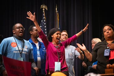 U.S. Rep. Ilhan Omar reacts after learning she won the Democratic endorsement over Don Samuels at the Fifth Congressional District's DFL endorsing con