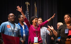 U.S. Rep. Ilhan Omar reacts after learning she won the Democratic endorsement over Don Samuels at the Fifth Congressional District's DFL endorsing con