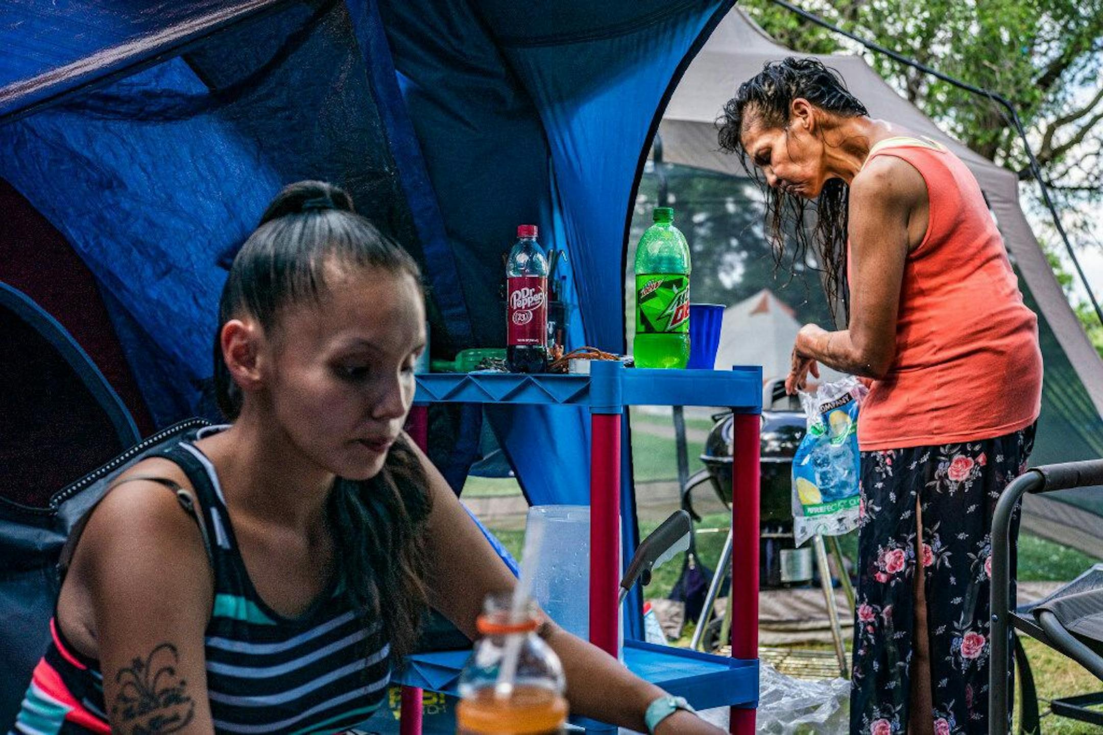 Julia Rainey, 29, left, and her mother Tonya Rainey lived next to each other in a tent compound. Both women struggle with chronic homelessness and were some of the hundreds of peole w having spent time at the Wall, the Hiawatha encampment, and now at Powder Horn.] Developing narrative of how the homeless encampment at Powderhorn Park is functioning amid growing controversy about safety in the neighborhood. RICHARD TSONG-TAATARII ¥ richard.tsong-taatarii@startribune.com Richard Tsong-Taatarii Pub