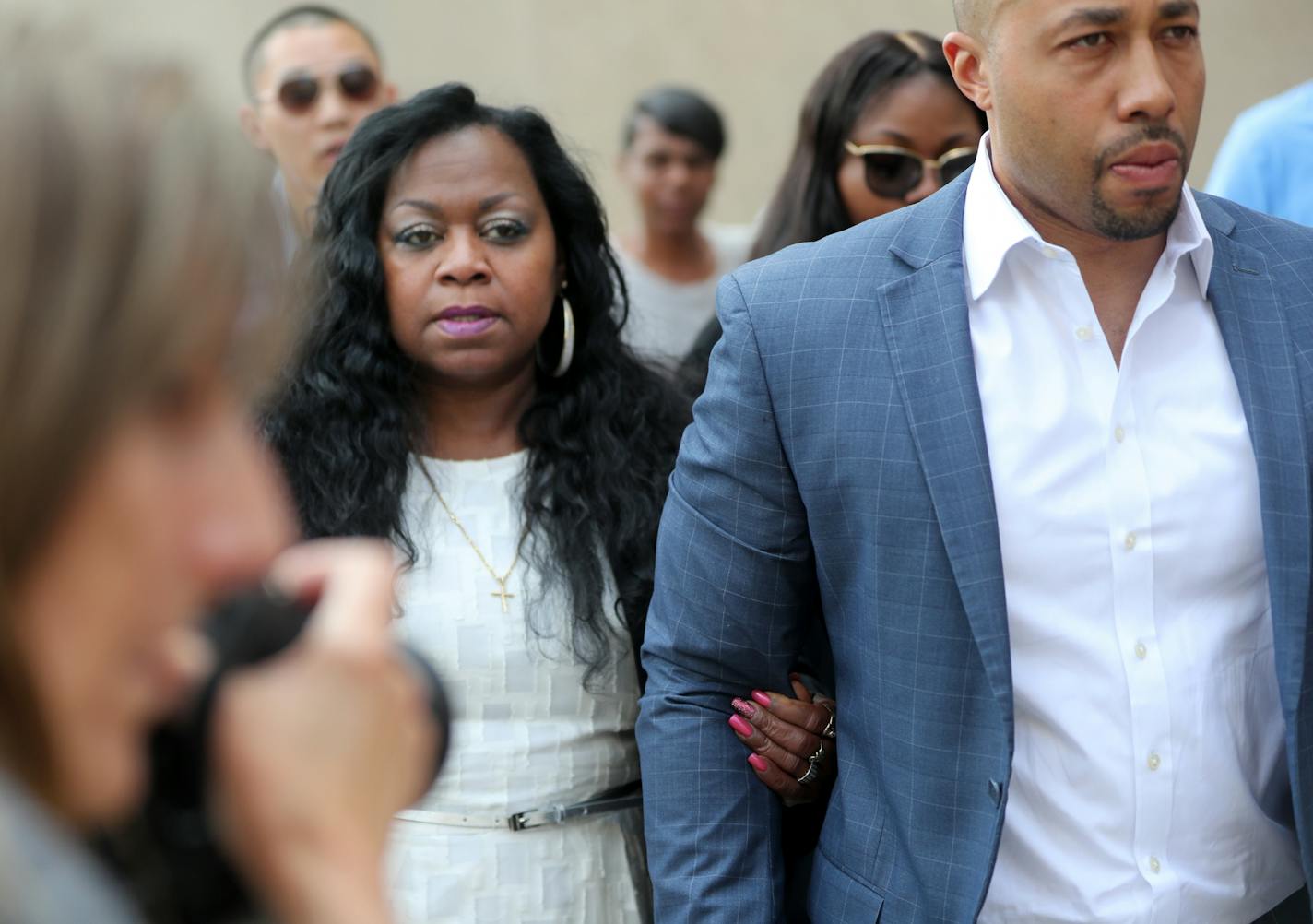 Valerie Castile, Philando Castile's mother, is escorted from court after the jury wrapped up work for Wednesday in St. Paul.