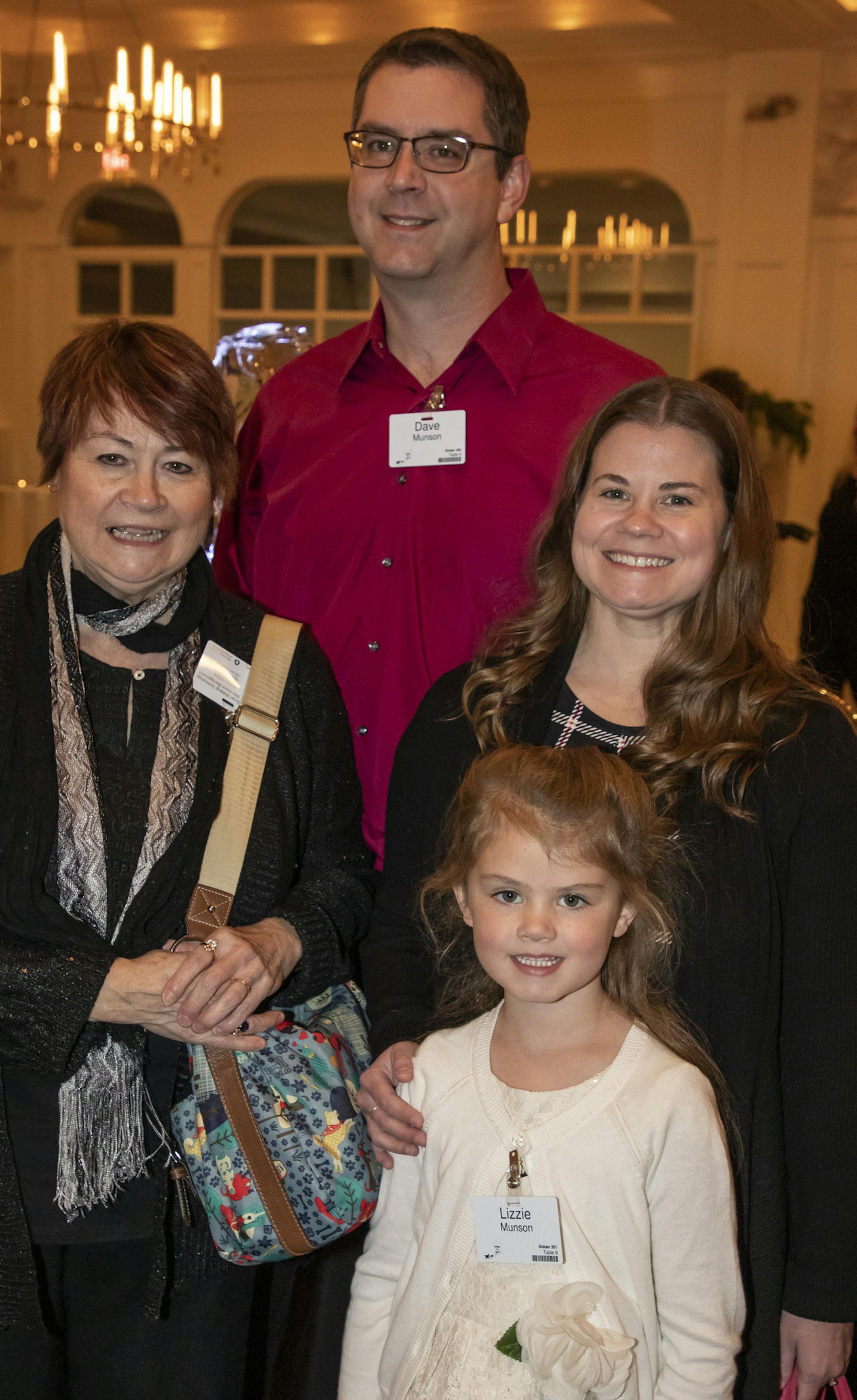 Cindy Sund, Dave & Tricia Munson with Lizzy at the Home for Life Gala. [ Special to Star Tribune, photo by Matt Blewett, Matte B Photography, matt@mattebphoto.com, November 9, 2019, Ashley Judd, Home for Life Fall Gala, Metropolitan Ballroom, Minnesota, SAXO 1009874367 FACE111719 Lizzy's name is spelled wrong on her nametag.