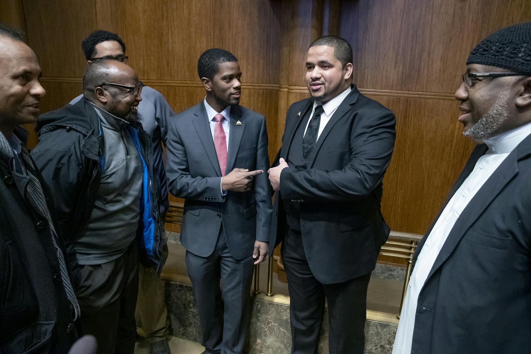 City Council Member Kassim Busuri and St. Paul Mayor Melvin Carter teased each other after he was sworn in at St. Paul City Hall, Wednesday, February 6, 2019 in St. Paul, MN. Busuri, a local educator, is the first Somali-American to serve on the St. Paul City Council.