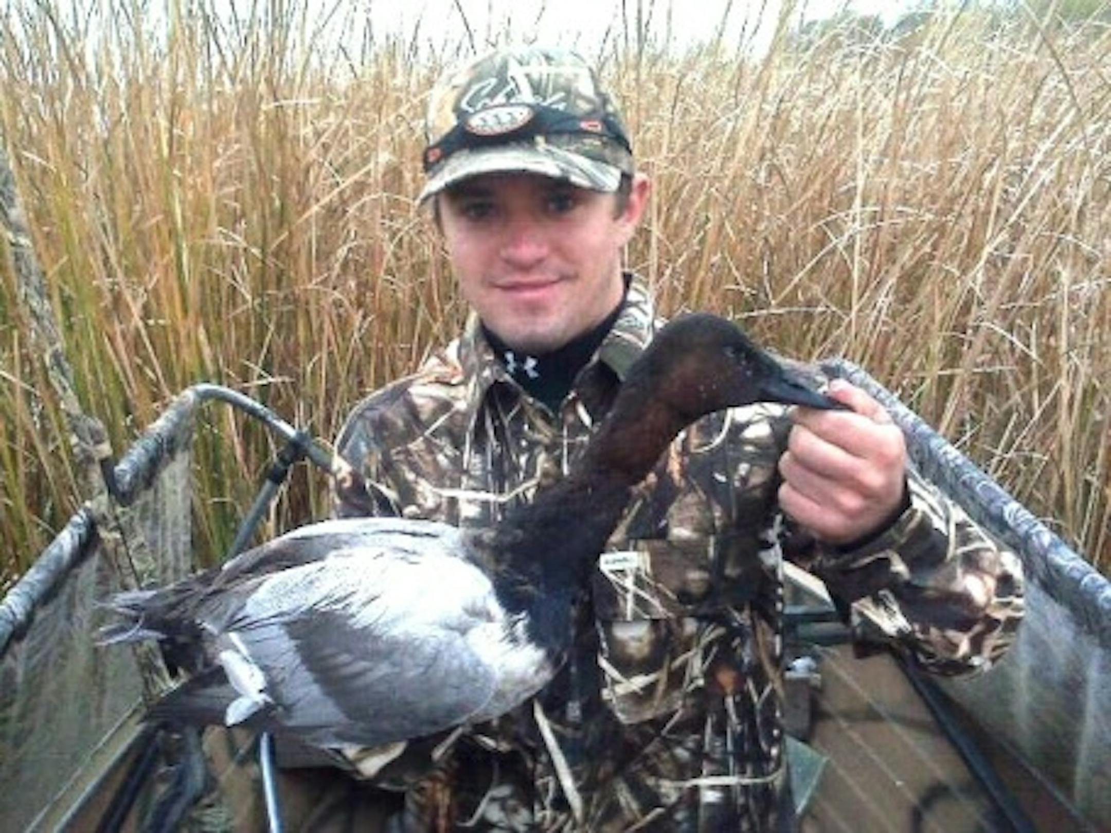 Pheasants Forever's Mike Stephenson with his first duck, a drake canvasback.