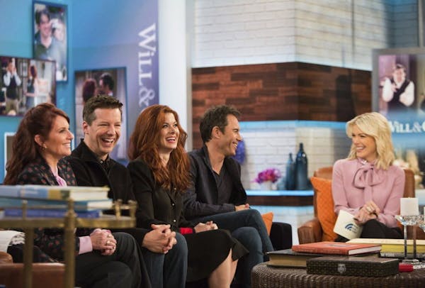 In this Monday, Sept. 25, 2017 photo, the cast of Will & Grace, from left, Megan Mullally, Sean Hayes, Debra Messing and Eric McCormack talk with Megy