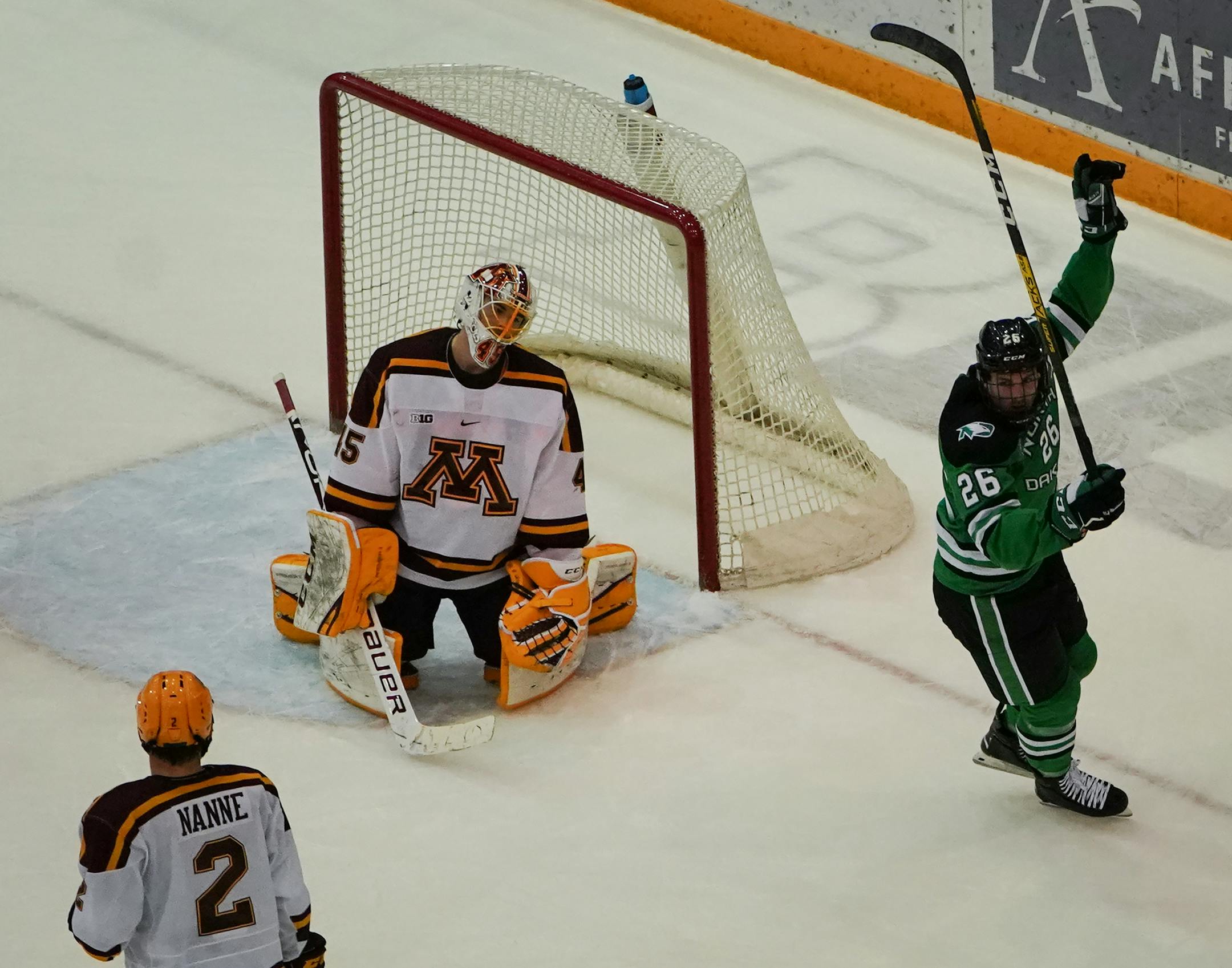 Gophers goaltender Jack LaFontaine reacted as North Dakota forward Cole Smith celebrated a goal by Colton Poolman in the first period.