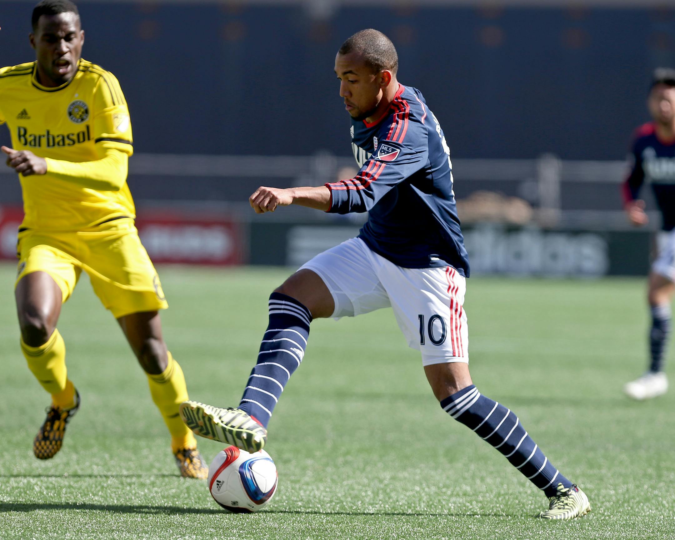 New England Revolution forward Teal Bunbury (10) dribbles the ball during the first half of a Major League Soccer game against the Columbus Crew, Saturday, April 11, 2015, in Foxborough, Mass. (AP Photo/Mary Schwalm) ORG XMIT: OTK111
