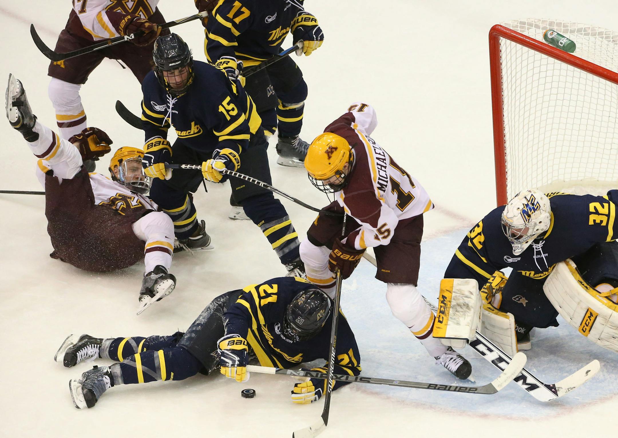 The University of Minnesota had chances to score on Merrimack College goalie Rasmus Tirronen (32) including here with A.J. Michaelson (15) in front of the net but couldn't convert during second period action of the Mariucci Classic Friday, Jan. 2, 2015, at Mariucci Arena in Minneapolis, MN.](DAVID JOLES/ STARTRIBUNE)djoles@startribune.com U of M men's hockey versus Merrimack