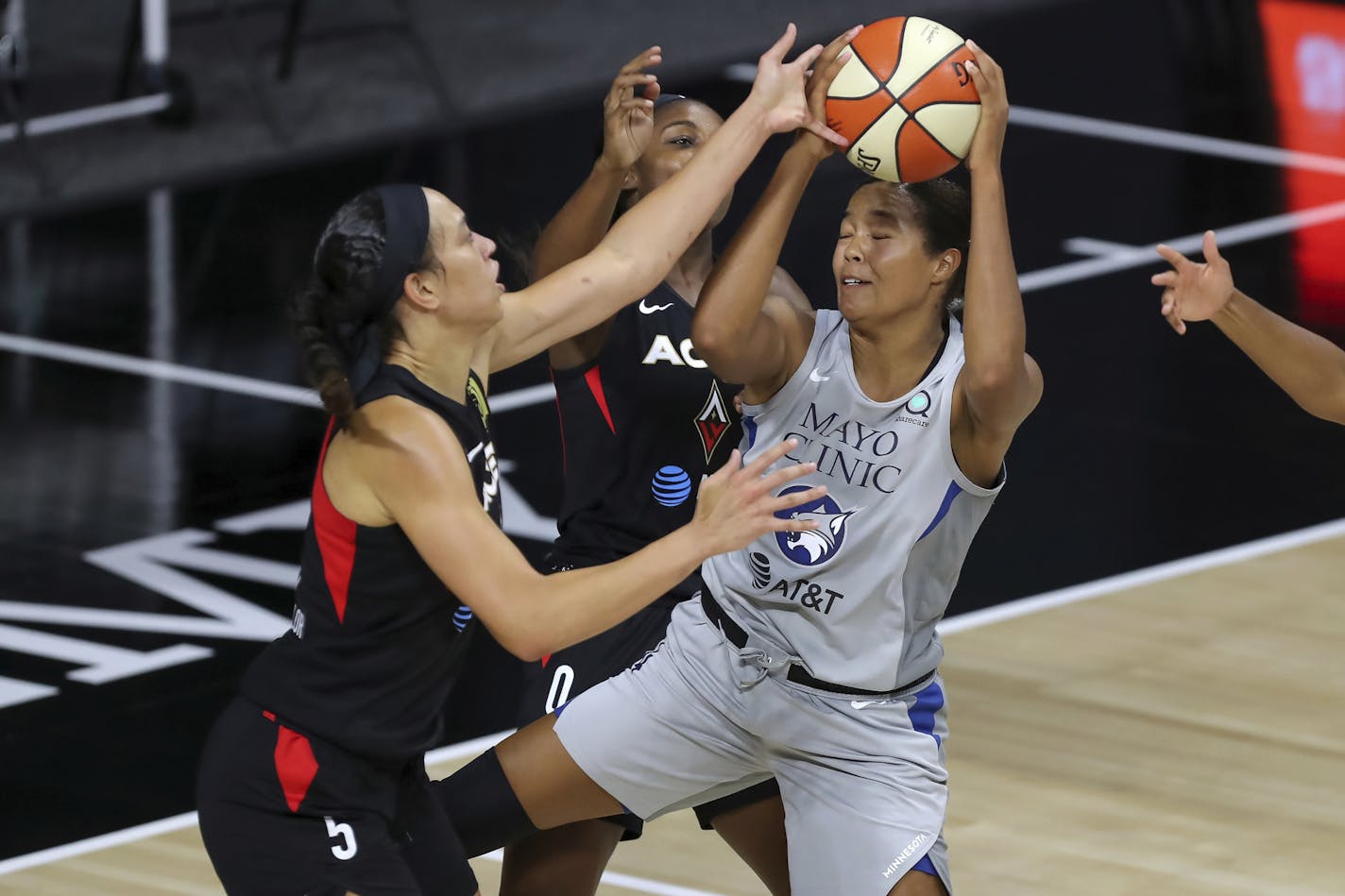 The Lynx's Napheesa Collier, right, was blocked by the Aces' Dearica Hamby during the second half of a WNBA game Thursday.