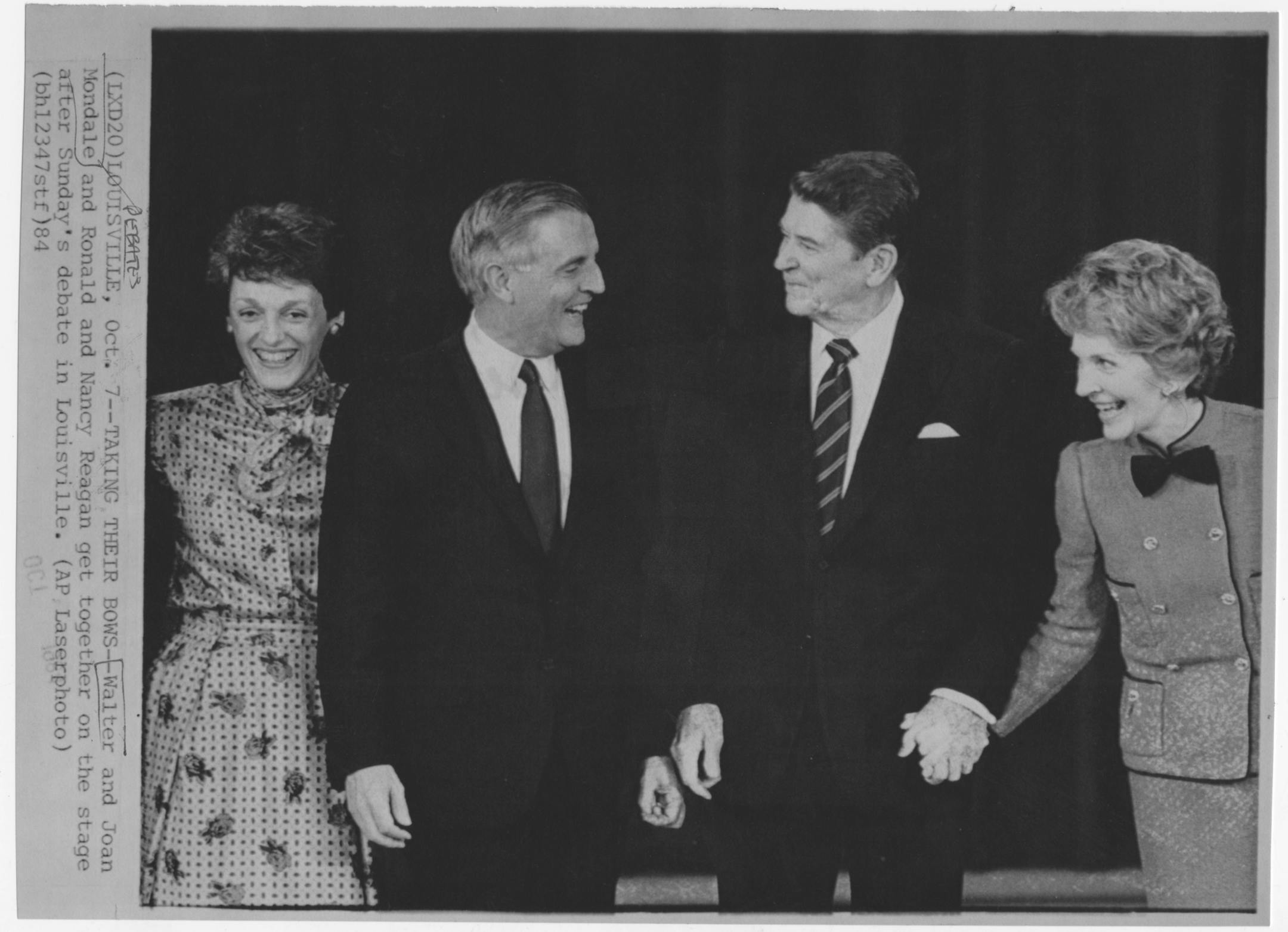 Walter and Joan Mondale and Nancy and Ronald Reagan get together on the stage after a debate in Louisville, Kentucky, on October 7, 1984.