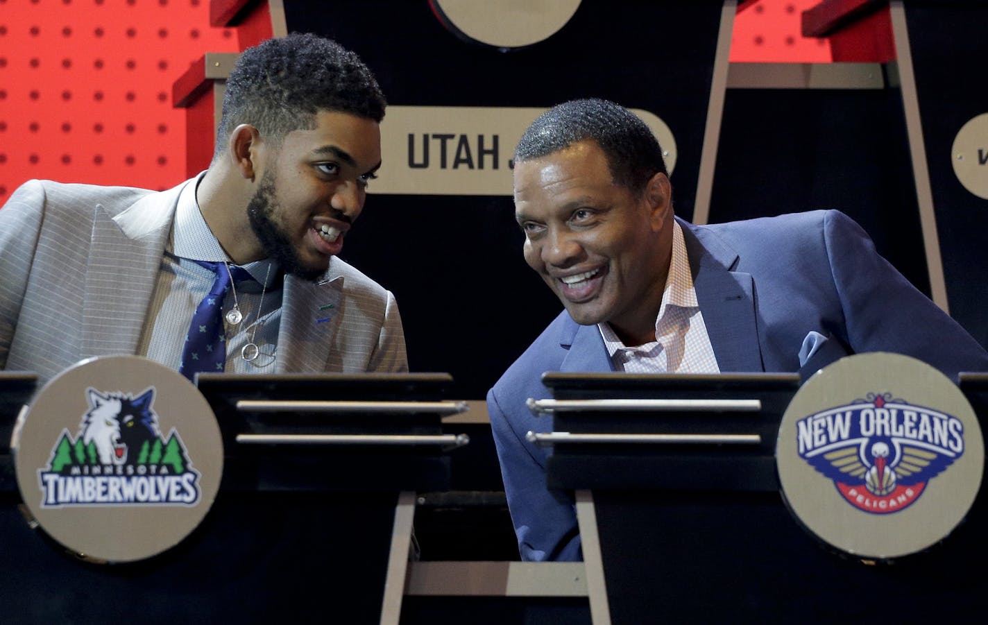 Minnesota Timberwolves center Karl-Anthony Towns, left, talks with New Orleans Pelicans head coach Alvin Gentry before the start of the NBA basketball draft lottery, Tuesday, May 17, 2016, in New York. (AP Photo/Julie Jacobson)